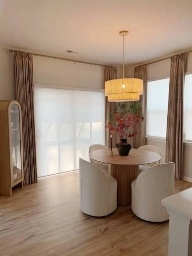 Mura Round Dining Table and Curved Cream Tub Dining Chairs