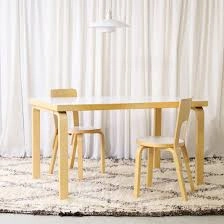 Svelto Bentwood Birch Dining Suite on Textured Wool Area Rug